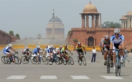 Cyclists ride past Rashtrapati Bhavan (The Presidential Palace) in New Delhi.