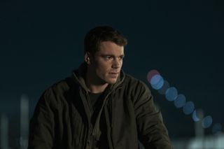 Peter looks pensive at night in The Night Agent season 2