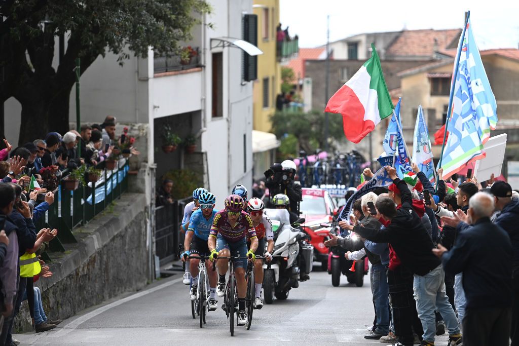 NAPLES ITALY MAY 11 LR Francesco Gavazzi of Italy and Team EOLOKometa Charlie Quarterman of The United Kingdom and Team Corratec Selle Italia and Alexandre Delettre of France and Team Cofidis compete in the breakaway while fans cheer during the 106th Giro dItalia 2023 Stage 6 a 162km stage from Naples to Naples UCIWT on May 11 2023 in Naples Italy Photo by Tim de WaeleGetty Images