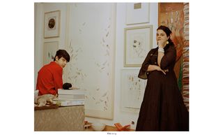 Woman and son in room full of artwork
