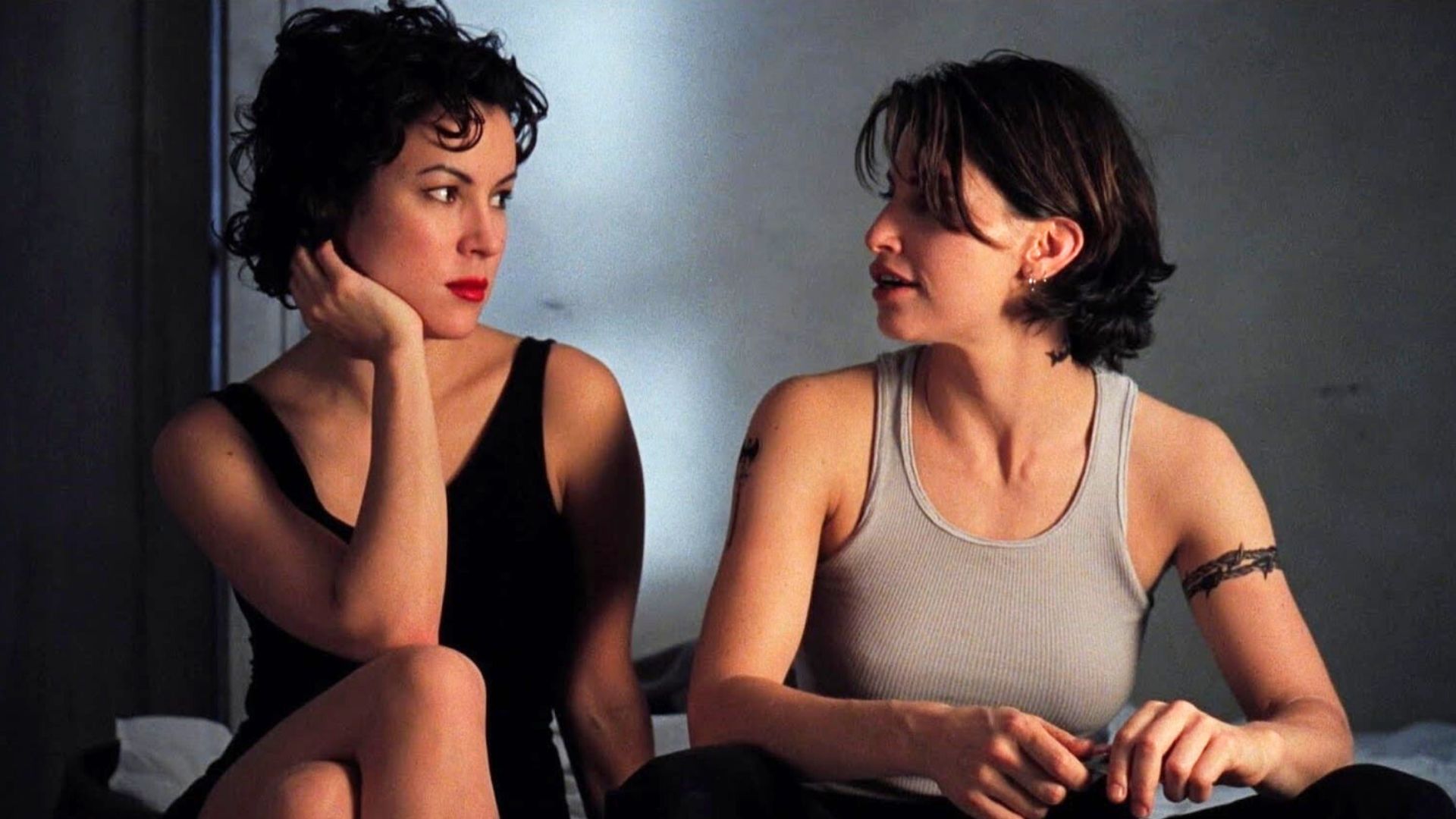 Jennifer Tilly and Gina Gershon look at each other