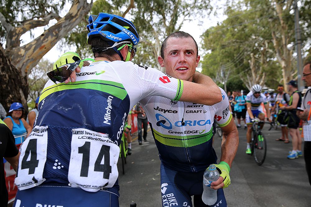 Teammates congratulate Simon Gerrans for his stage 3 win.