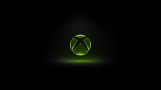 Xbox logo glowing green against a dark black background, centered with a soft light effect underneath, creating a dramatic and high contrast visual.