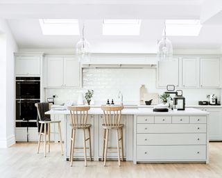 White kitchen ideas with wood flooring