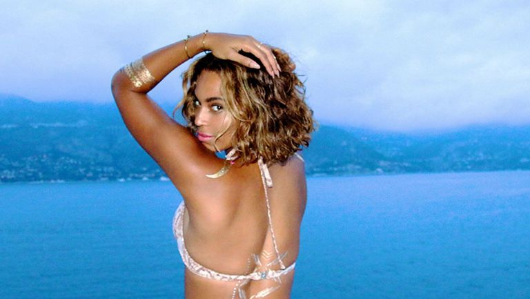 Beyonce posing with tattoos