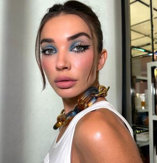 A blue eyeshadow makeup look by Chynara Kojoeva.