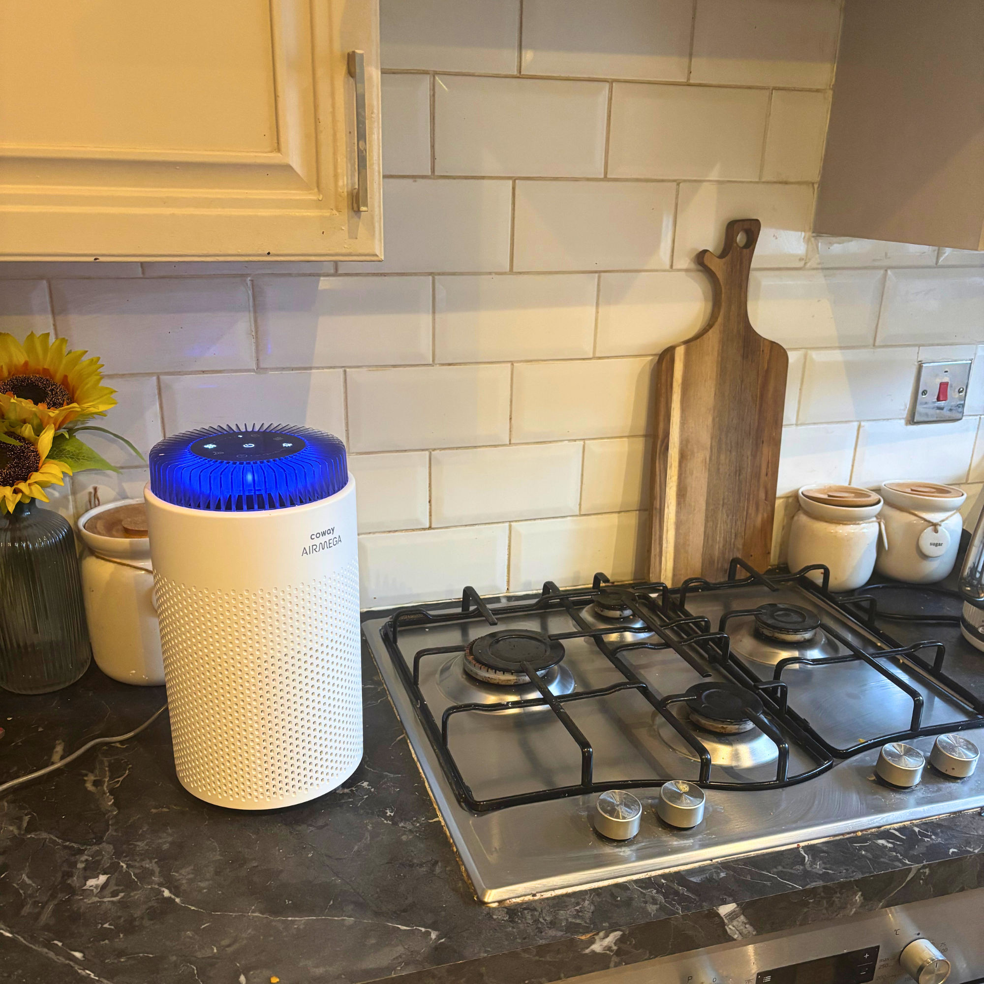 Coway Airmega 50 on kitchen worktop placed next to hob