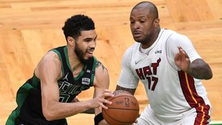 Jayson Tatum #0 of the Boston Celtics looks to pass against P.J. Tucker #17 of the Miami Heat during the second half in Game Six of the 2022 NBA Playoffs Eastern Conference Finals