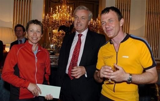 Jane Tomlinson in May 2004 with British ambassador to France, Sir John Holmes, and her brother Luke (r). She attended the British embassy in Paris as part of the Rome to Leeds charity ride.