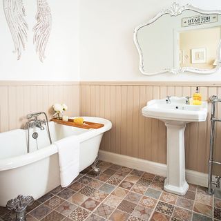 Neutral bathroom with Victorian style floor tiles