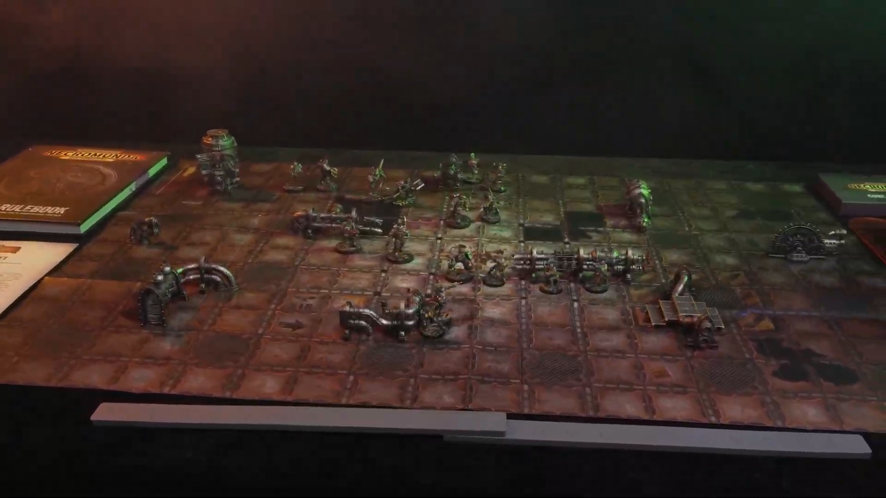 Necromunda Skirmish miniatures on a rusted, disused battlefield