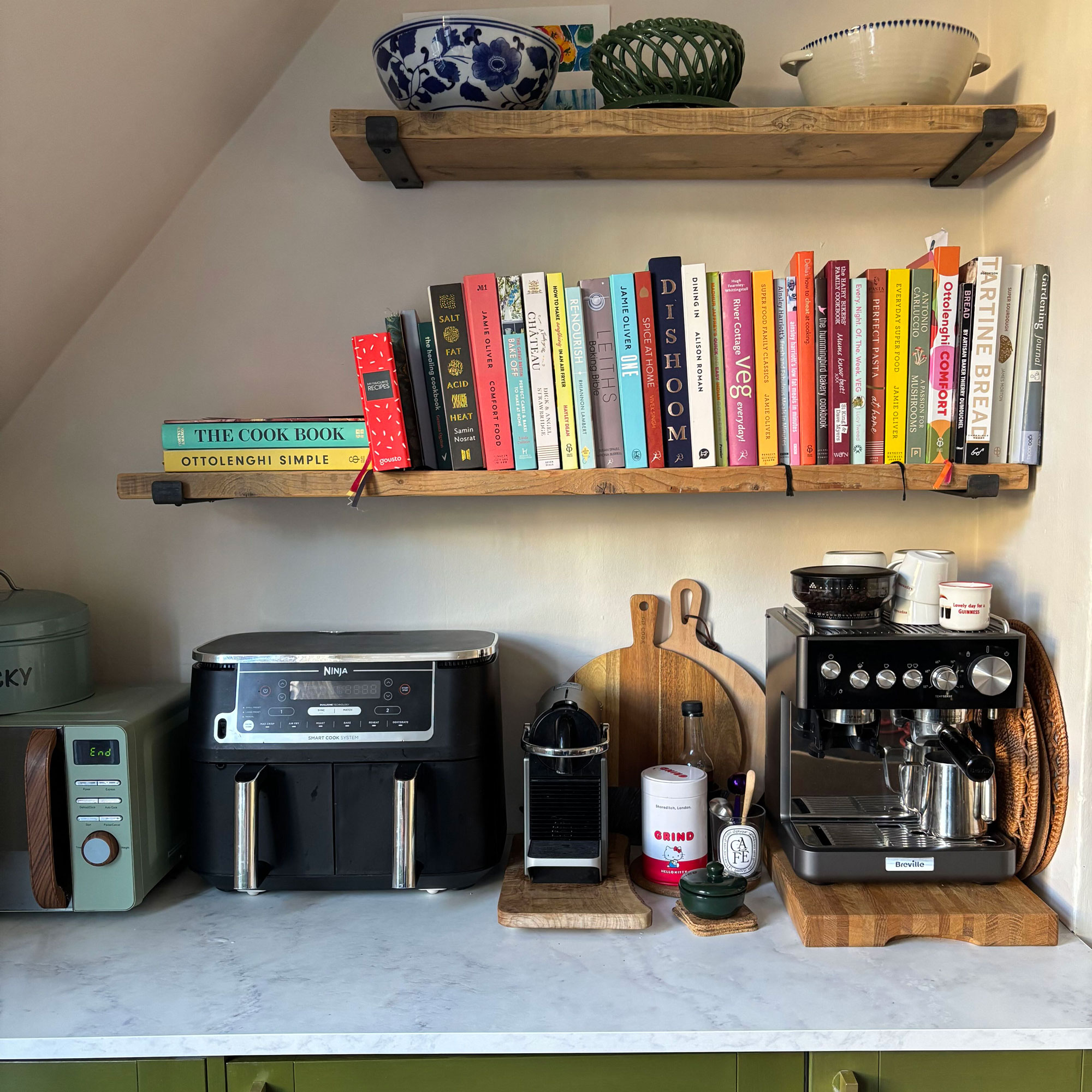 kitchen appliance counter with two coffee machines, air fryer and microwave