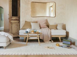 living room with light coloured flooring and rug
