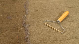 Carpet scraper on brown carpet