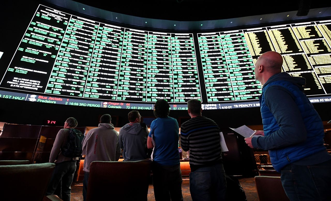 Bettors line up to place wagers for Super Bowl LI at the Race &amp;amp; Sports SuperBook at the Westgate Las Vegas Resort &amp;amp; Casino.