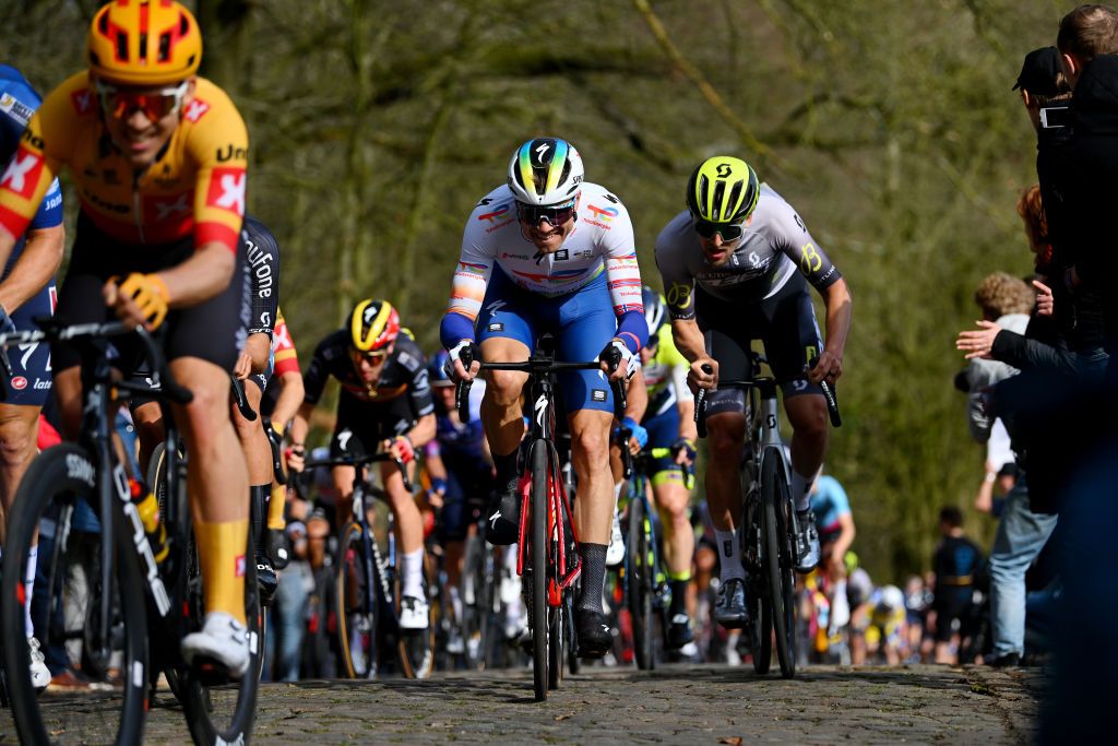 BREDENE BELGIUM MARCH 17 Edvald BoassonHagen of Norway and Team TotalEnergies competes passing through a Kemmelberg cobblestones sector during the 21th Bredene Koksijde Classic 2023 a 1916km one day race from Bredene to Koksijde on March 17 2023 in Koksijde Belgium Photo by Luc ClaessenGetty Images
