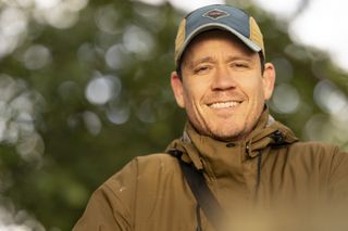 Portrait with dappled light through a tree and smooth bokeh