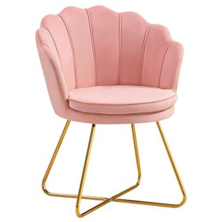 Pink scalloped back velvet vanity chair with gold legs that crossover centrally underneath