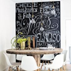 bistro blackboard with wooden round table and chairs
