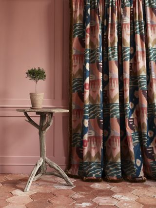 velvet patterned curtains with hexagonal terracotta floor tiles