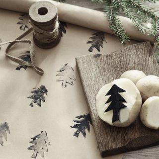 Neutral brown paper with twine and Christmas trees