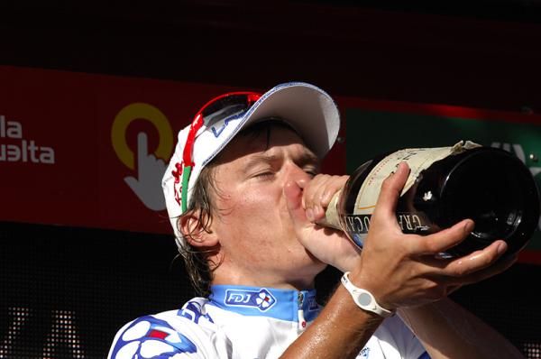 Yauheni Hutarovich (FDJ) quenches his thirst with a big gulp of champagne.