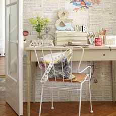 room with wooden flooring and desk with chair