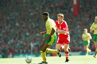 Efan Ekoku in action for Norwich City against Liverpool at Anfield in April 1994.