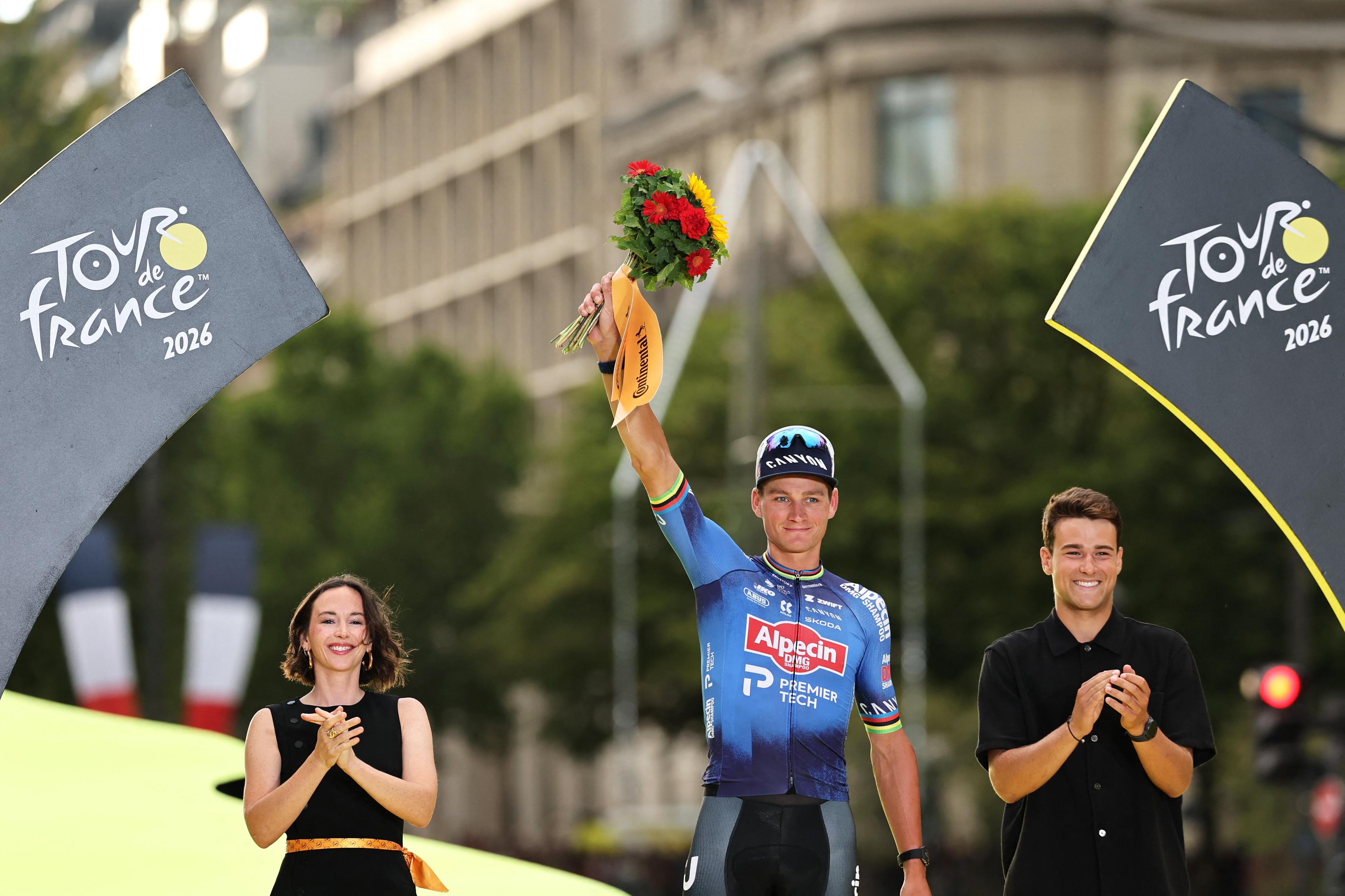 Alpecin - Premier Tech team's Dutch rider Mathieu van der Poel celebrates on the podium after winning the 21st stage of the 113th edition of the Tour de France cycling race, 88,7 km starting and finishing in Paris, on July 26, 2026. (Photo by Anne-Christine POUJOULAT / AFP)