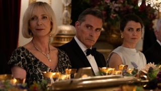 (L to R) Allison Janney as Grace, Rufus Sewell as Hal Wyler, Keri Russell as Kate Wyler sitting at a dinner table.