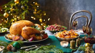 Roast turkey on a table set for Christmas