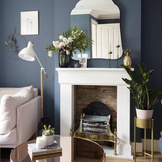 blue indigo wall with fireplace and wooden flooring