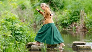 Sophie, Duchess of Edinburgh seen using stepping stones to cross a stream as she attends day 3 of the 2023 Royal Windsor Horse Show in Home Park, Windsor Castle on May 13, 2023 in Windsor, England.