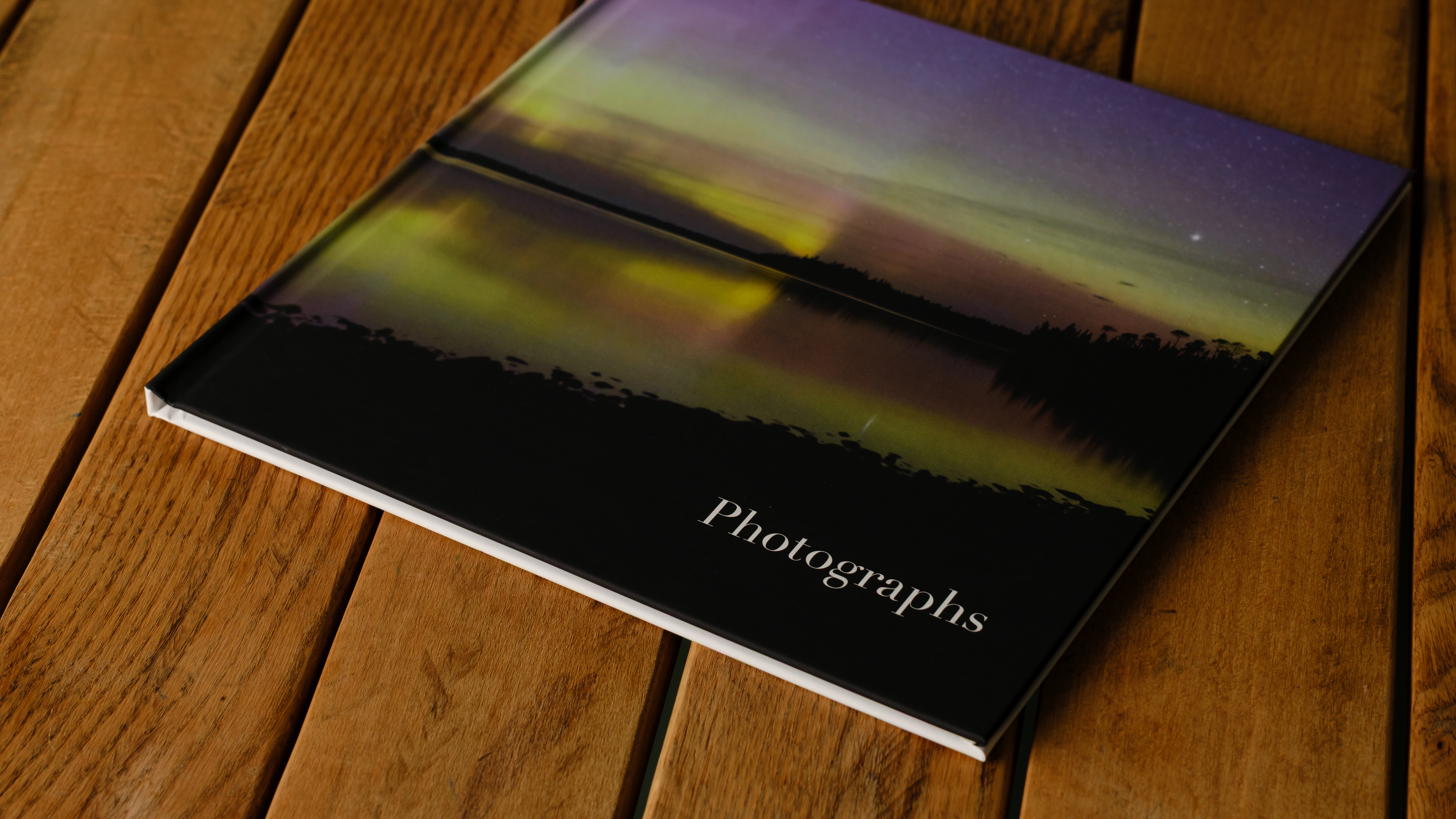 Mixbook photo books on a desk