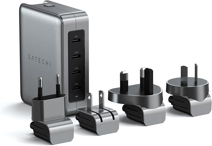 Four plugs lined up in front of a Satechi GaN Travel Charger