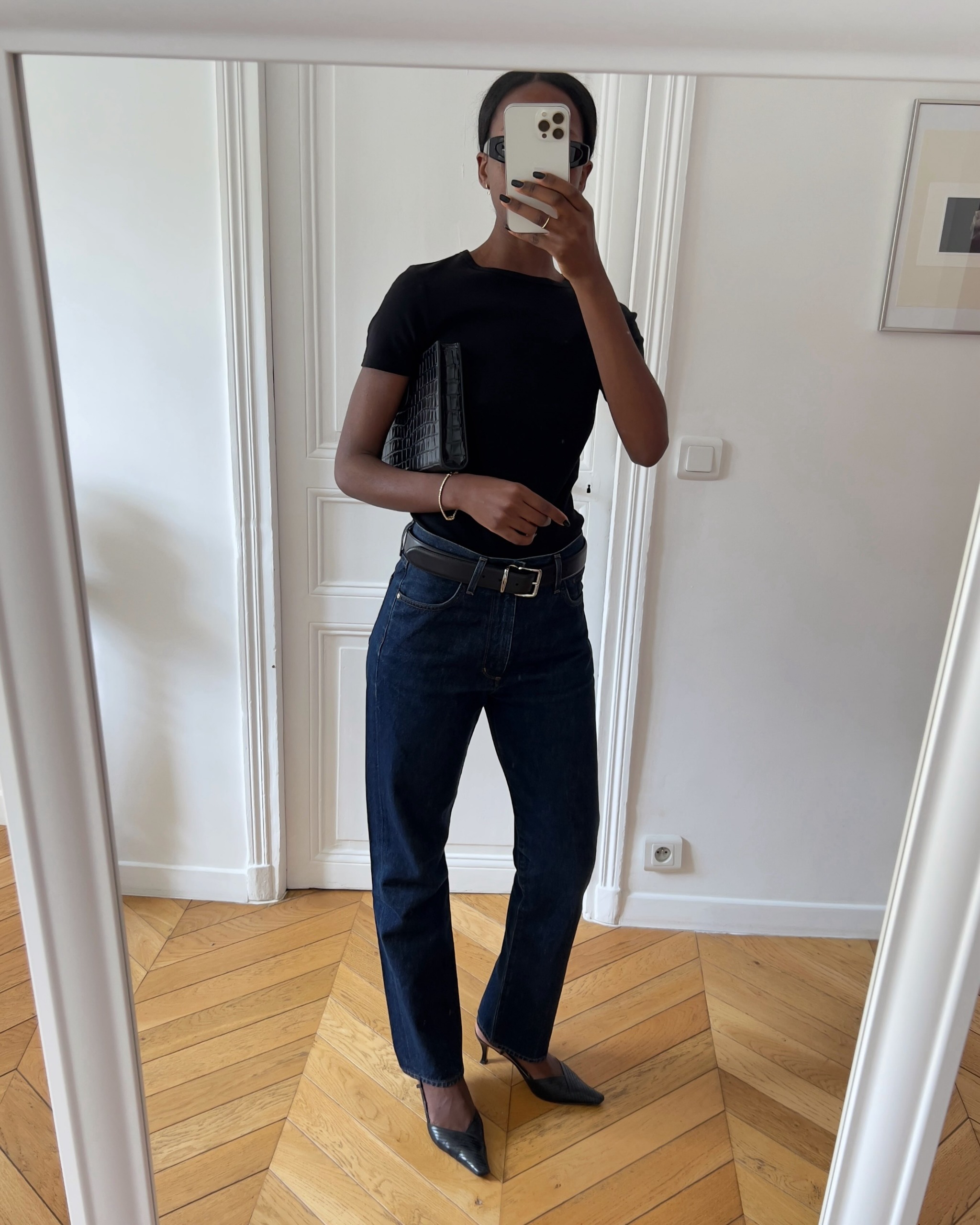 Influencer Sylvie Mus wearing indigo jeans and slingback kitten heels.