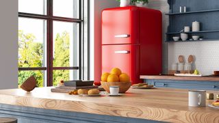 Freestanding red fridge freezer in kitchen