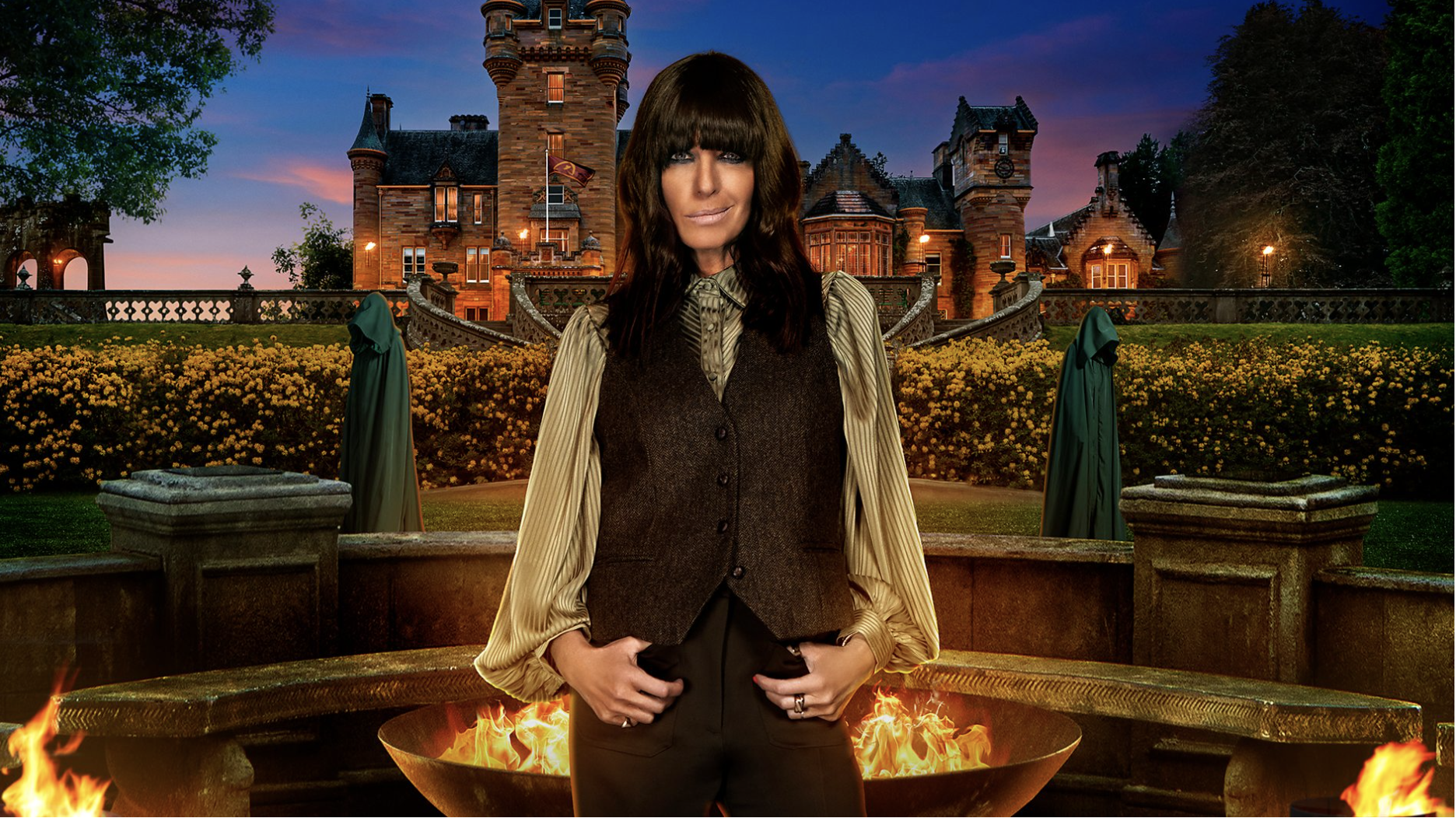an image of claudia winkleman standing in front of the traitor's castle