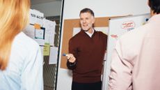 British business leader in a meeting