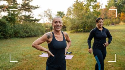 Two women using ankle weights to workout in the park, laughing and smiling together