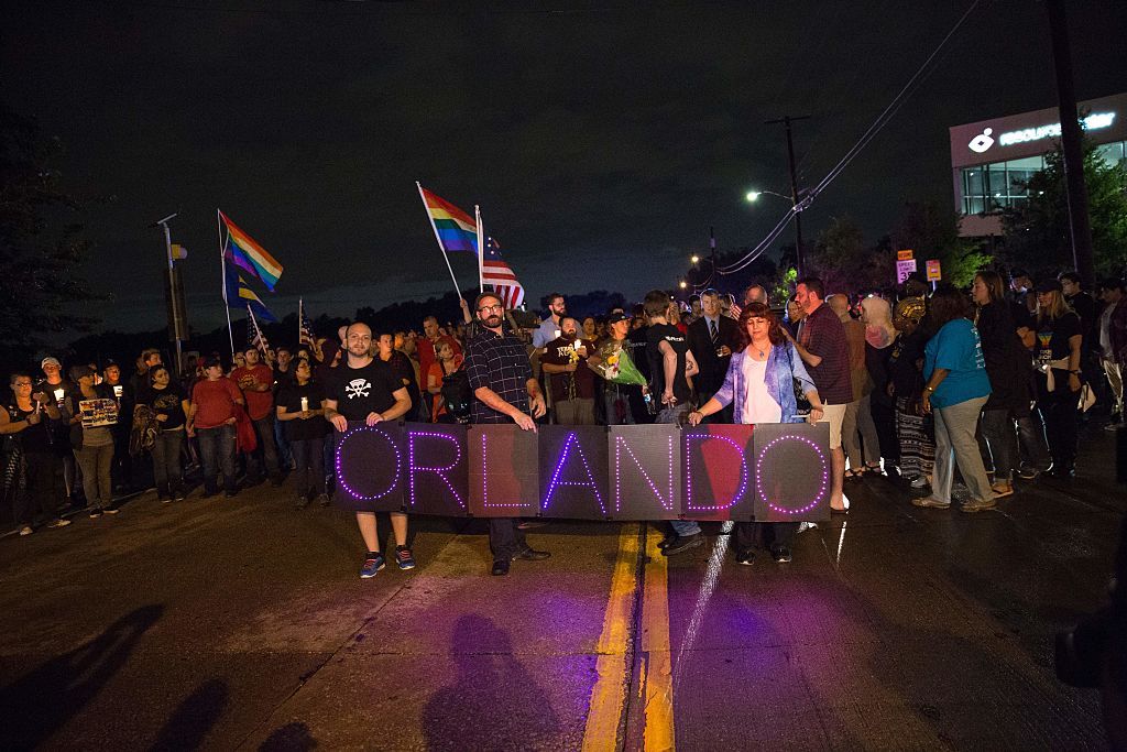 A gay pride parade in Dallas remembers the victims of a shooting in Orlando