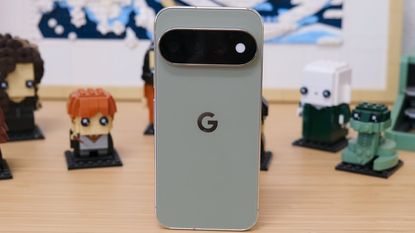 Google Pixel 11 Pro resting on a wooden table