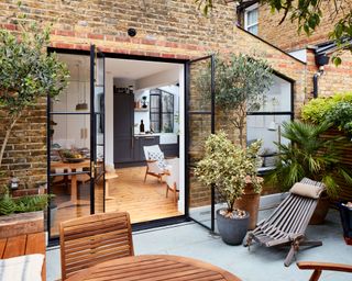 First-time buyers Lois and Guy used their industry skills to turn a tired old ground-floor flat into a spacious modern home