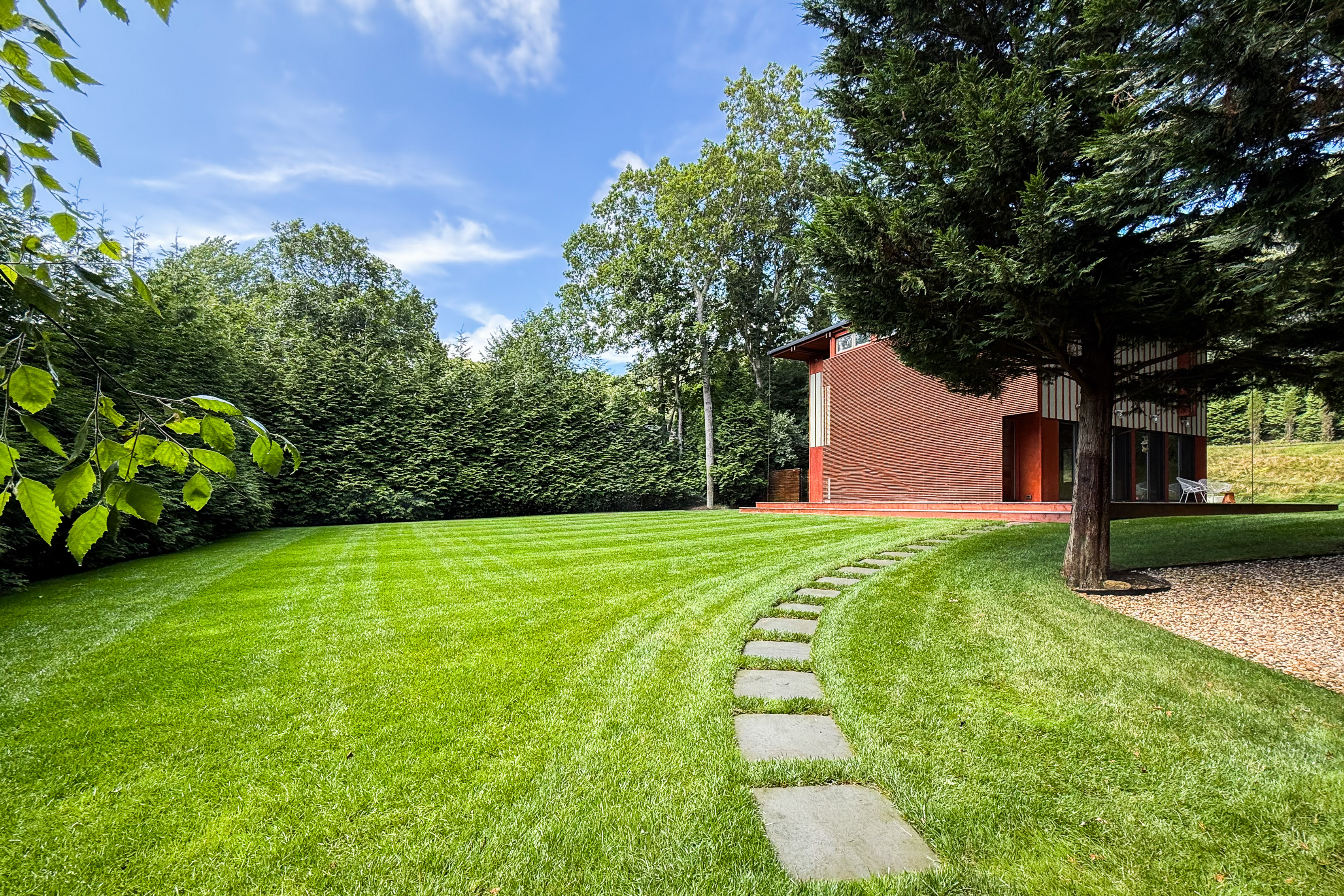 The house is set in 0.61 acres of private gardens