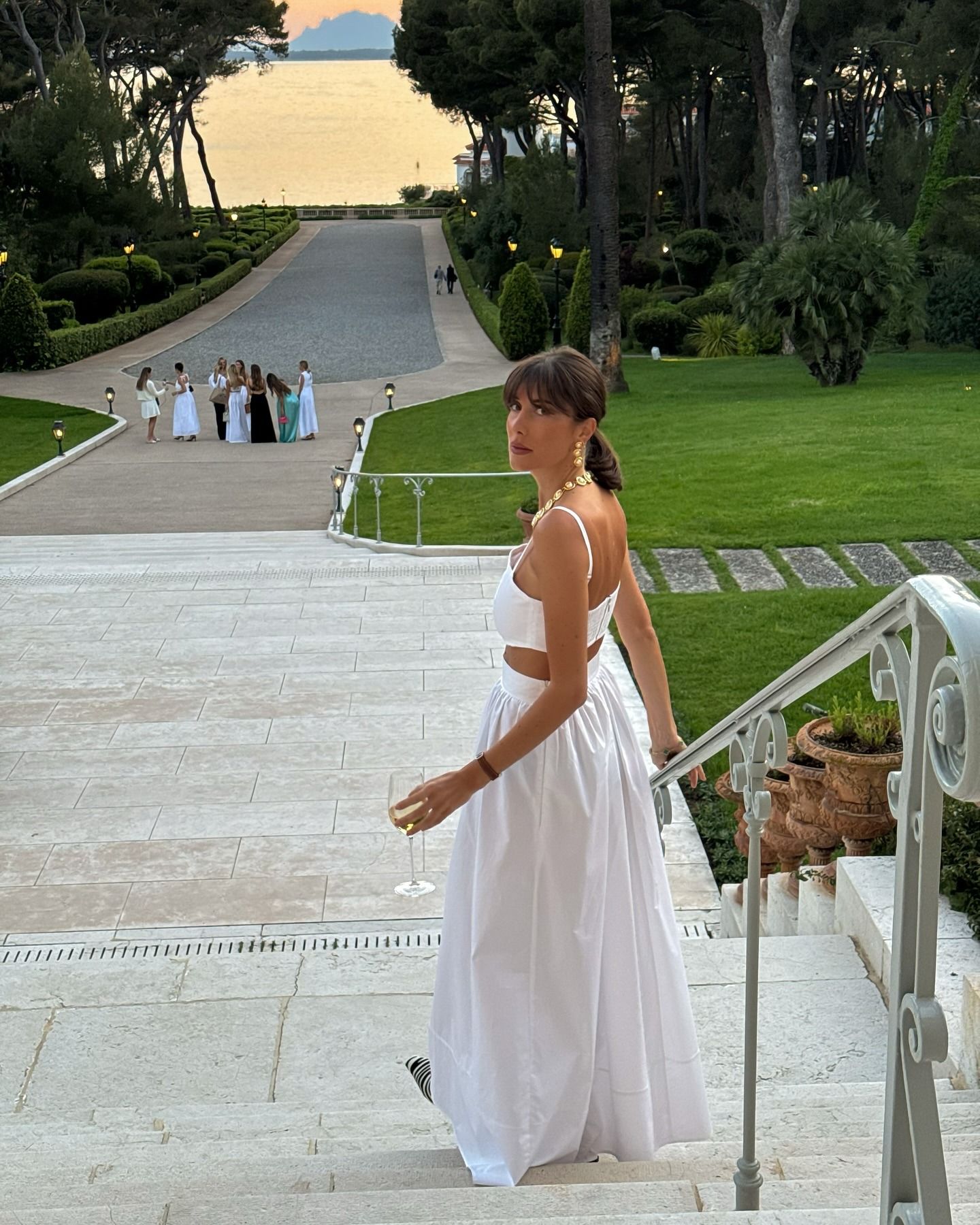 Influencer wearing a long full white maxi skirt