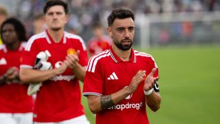 Bruno Fernandes and Harry Maguire of Manchester United applaud the fans after the pre-season friendly match between Paris Saint-Germain and Manchester United at Parc des Princes on August 08, 2026 in Paris, France.