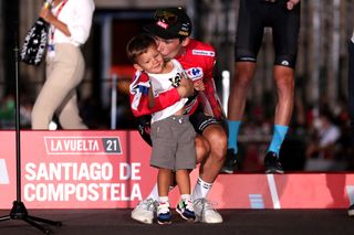 SANTIAGO DE COMPOSTELA SPAIN SEPTEMBER 05 Primoz Roglic of Slovenia and Team Jumbo Visma kisses his son Levom celebrate winning the red leader jersey on the podium ceremony in the Plaza del Obradoiro with the Cathedral in the background after the 76th Tour of Spain 2021 Stage 21 a 338 km Individual Time Trial stage from Padrn to Santiago de Compostela lavuelta LaVuelta21 ITT on September 05 2021 in Santiago de Compostela Spain Photo by Gonzalo Arroyo MorenoGetty Images