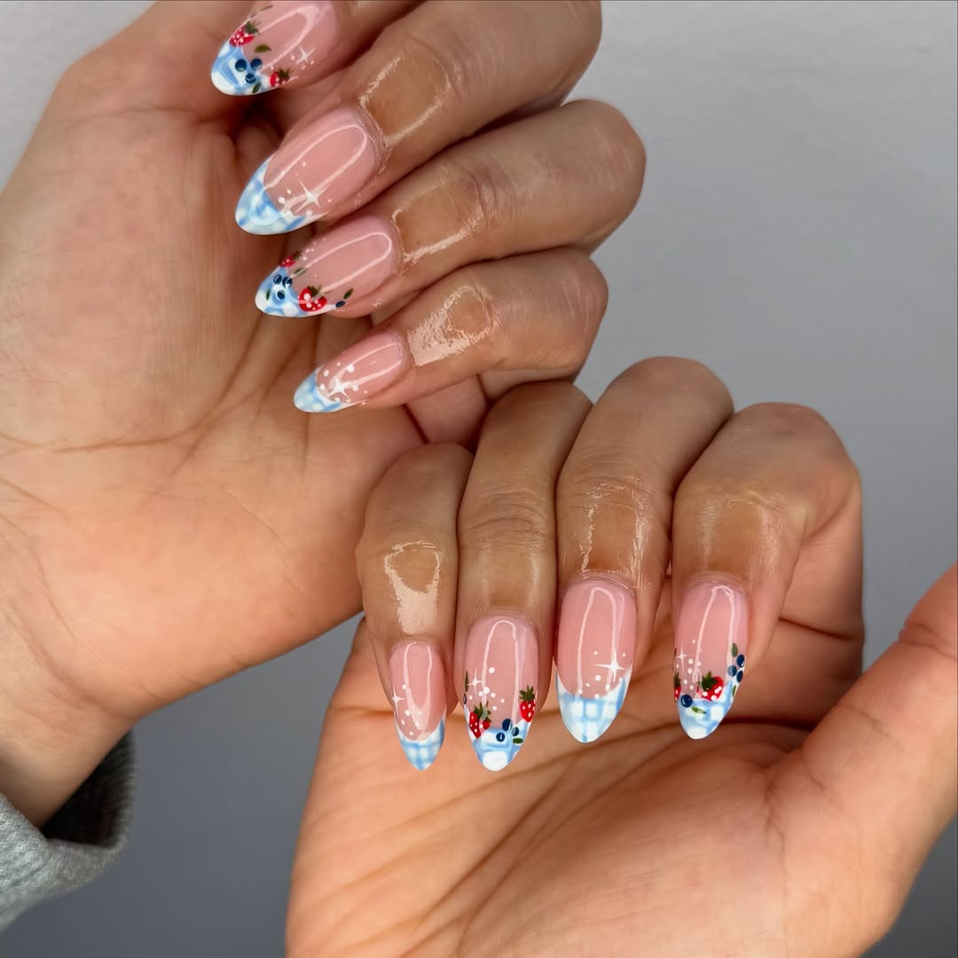 blue and white striped nails with strawberry design