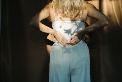 Endometriosis diagnosis: a woman suffering with back pain