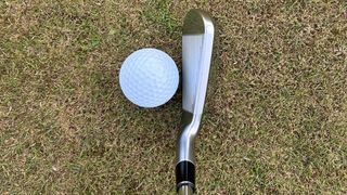 Photo of the Srixon ZXiU Utility Iron in behind the ball